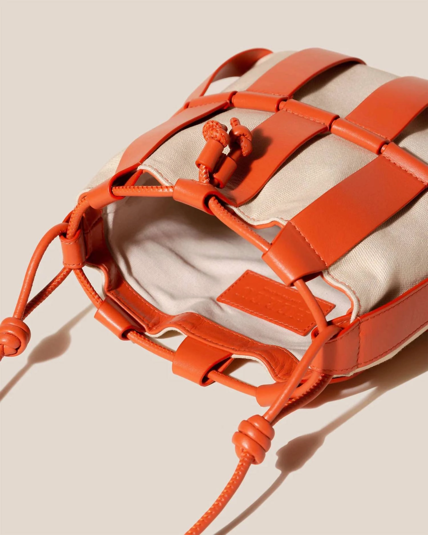 Llinera Drawstring Crossbody Bag In Ivory / Papaya