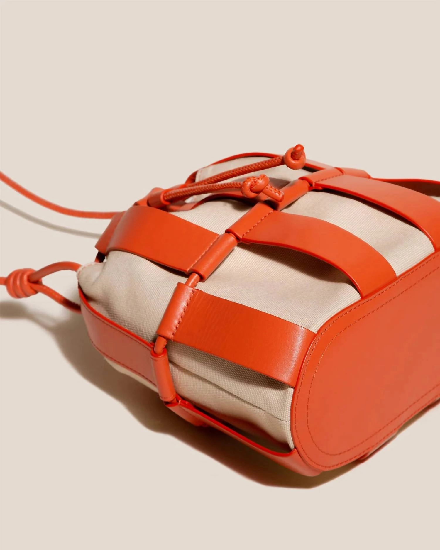 Llinera Drawstring Crossbody Bag In Ivory / Papaya