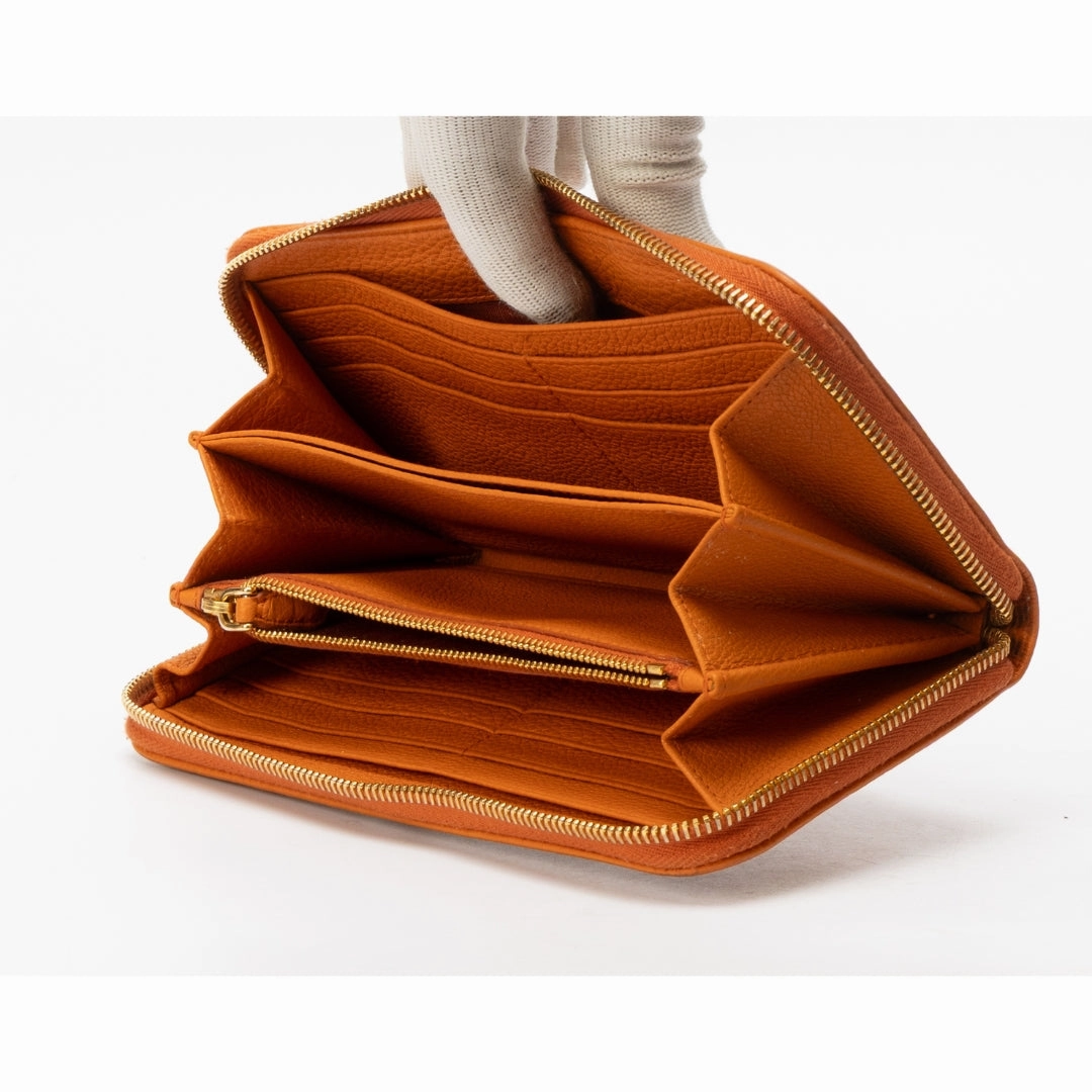 Prada Orange Pebbled Leather Zip Around Wallet